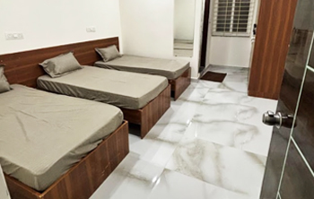 3-sharing non-AC room at Casavir Mens PG Madhapur, well-lit modern setup